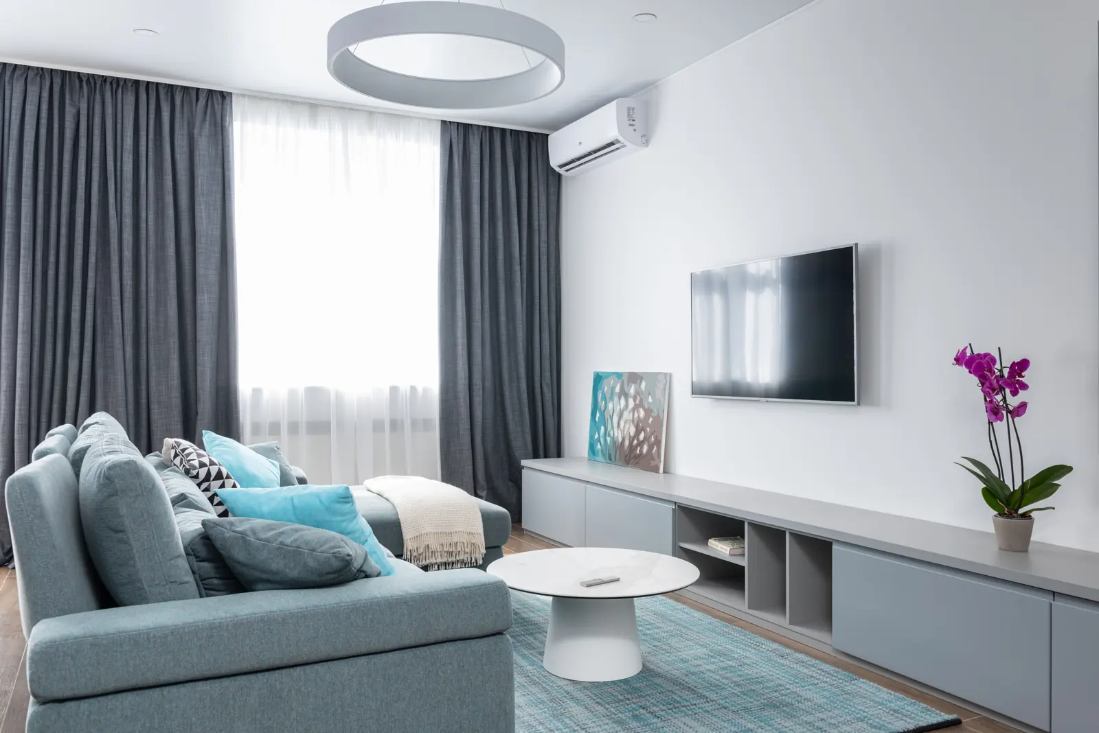 Bright living room with a wall-mounted air conditioner